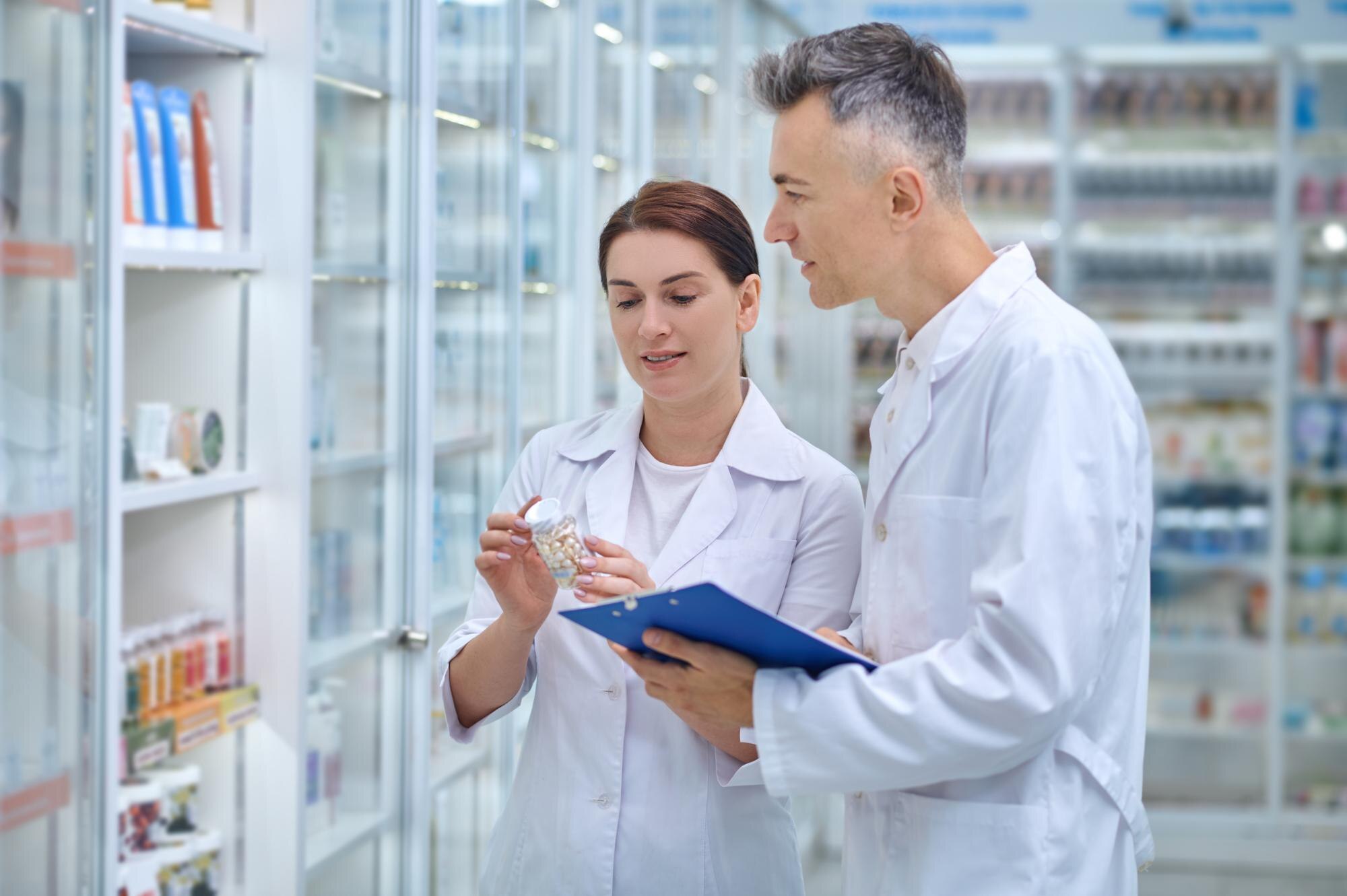 revision-two-pharmacists-making-medicines-revision-drugstore_259150-57968